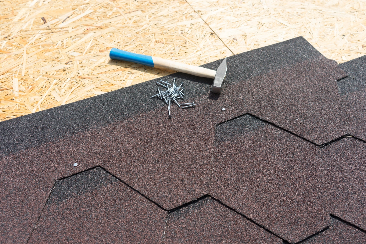 close up to architectural shingle installation